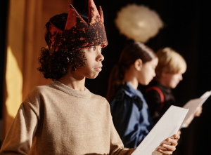 A child holding a script
